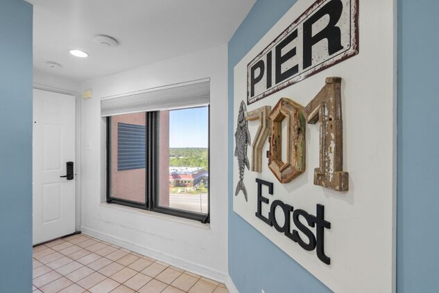 Entry hall with coastal Pier East decor