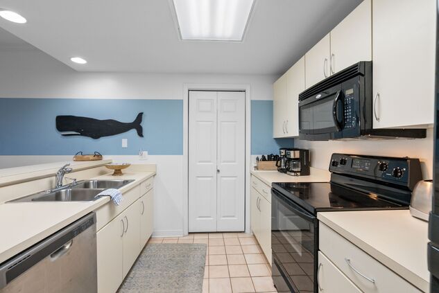 White kitchen with stainless steel appliances
